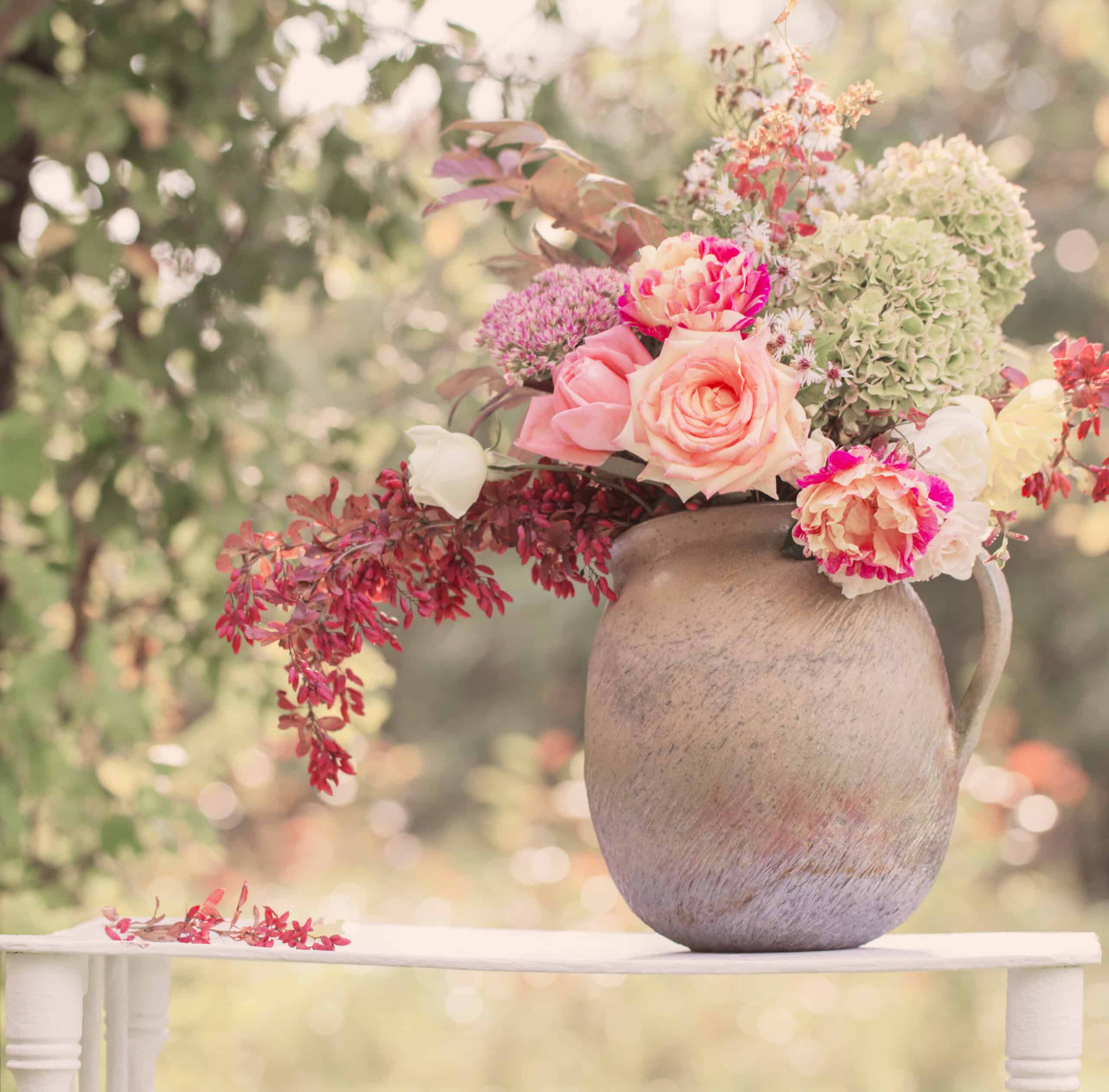 beautiful bouquet on wooden shelf in garden